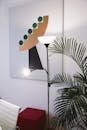 Stylish interior featuring modern artwork, lighting, and a lush plant.