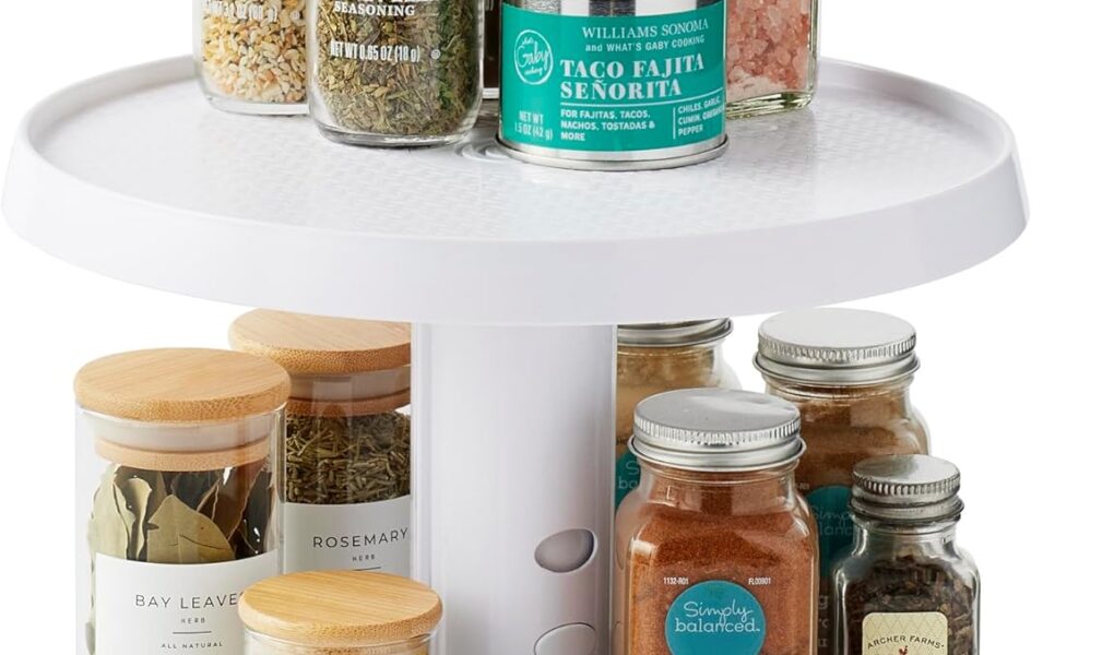 youcopia lazy susan turntable spinning inside a kitchen cabinet with spice jars