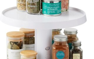 youcopia lazy susan turntable spinning inside a kitchen cabinet with spice jars