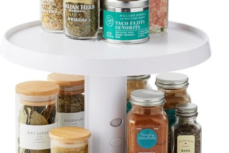youcopia lazy susan turntable spinning inside a kitchen cabinet with spice jars