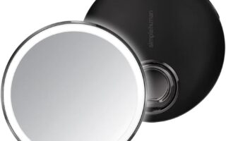 simplehuman sensor mirror lit up on a bathroom counter