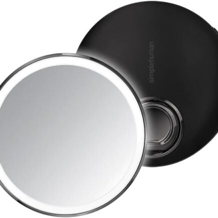 simplehuman sensor mirror lit up on a bathroom counter