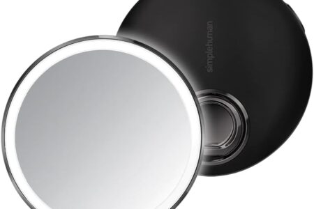 simplehuman sensor mirror lit up on a bathroom counter