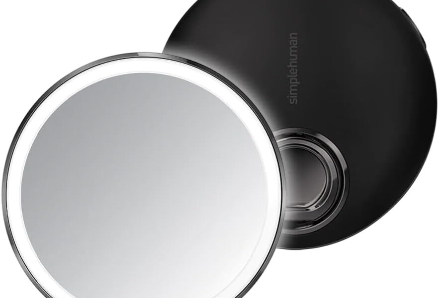 simplehuman sensor mirror lit up on a bathroom counter