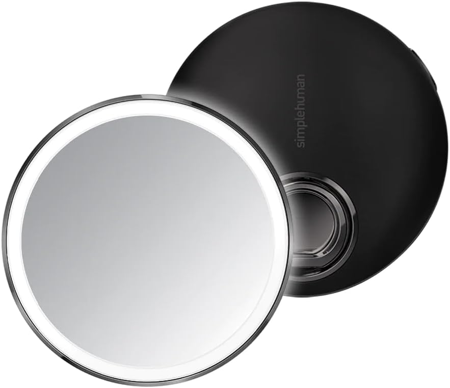 simplehuman sensor mirror lit up on a bathroom counter