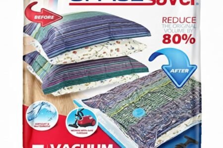 spacesaver vacuum storage bags compressing a folded comforter on a closet shelf